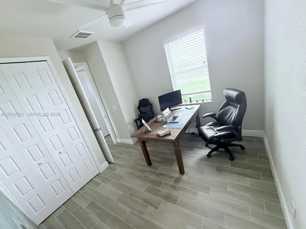 a living room with furniture and a rug