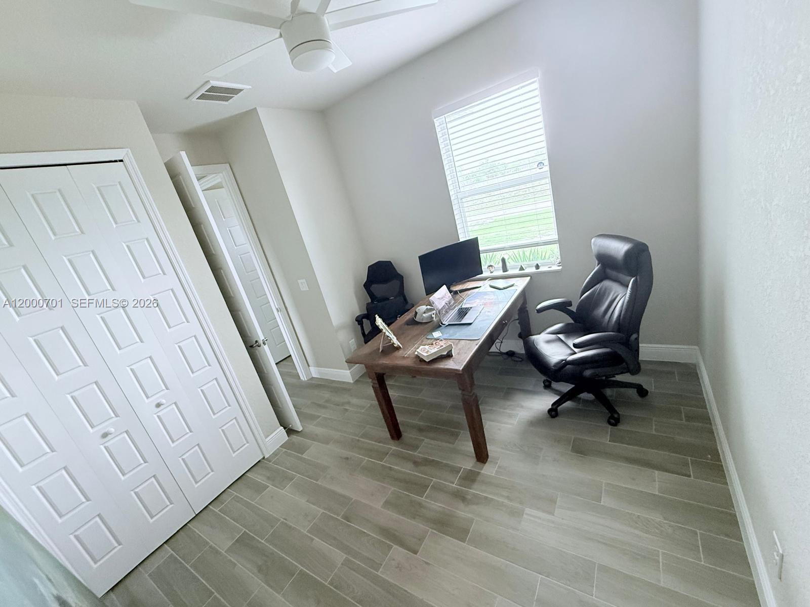 368 Neighborly Road LaBelle, FL 33935 - Photo 13 of 23 a living room with furniture and a rug