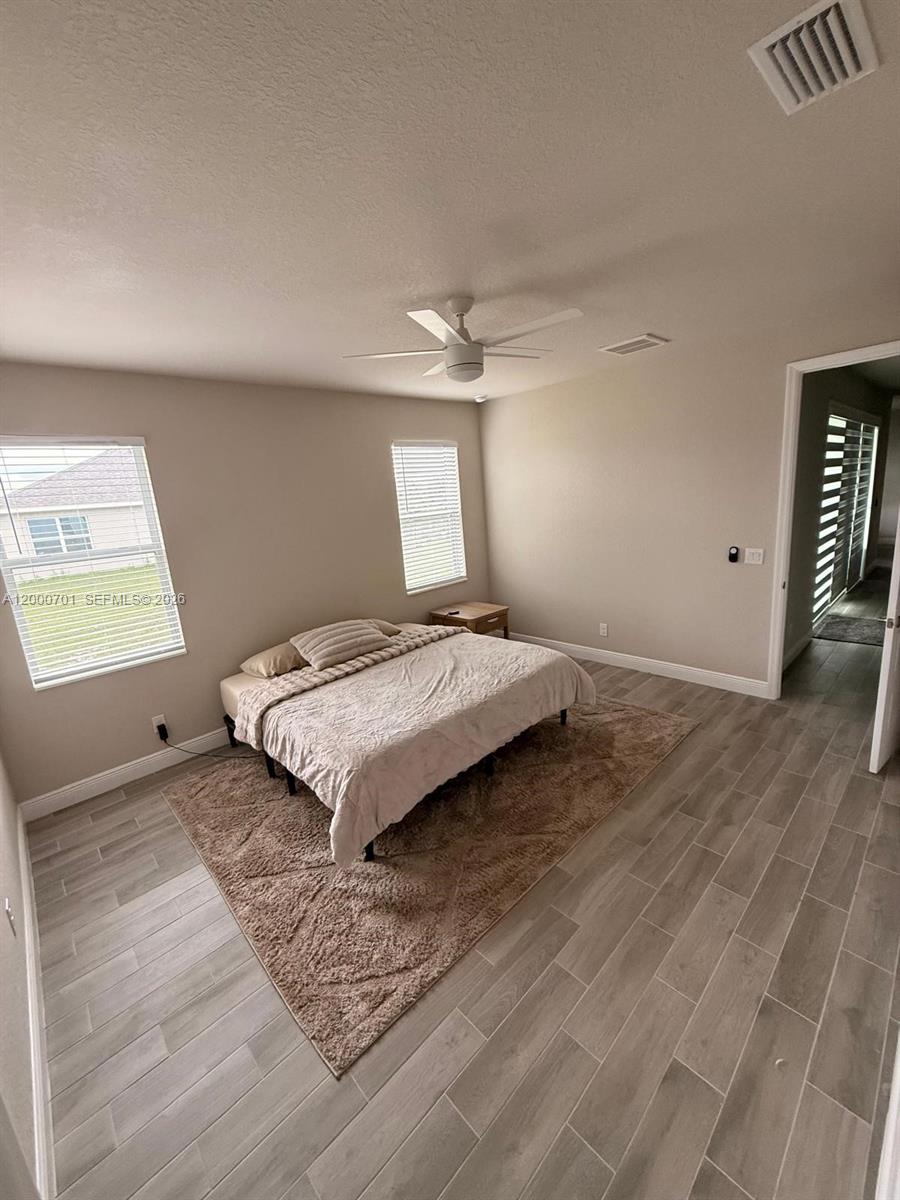 368 Neighborly Road LaBelle, FL 33935 - Photo 18 of 23 a bedroom with a bed and a window