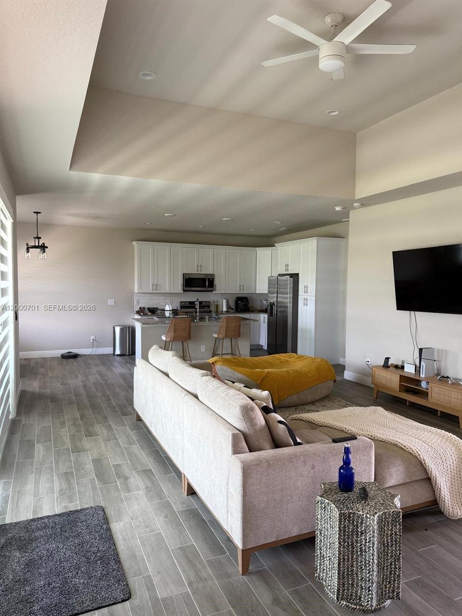 368 Neighborly Road LaBelle, FL 33935 - Photo 6 of 23 a living room with furniture and flat screen tv