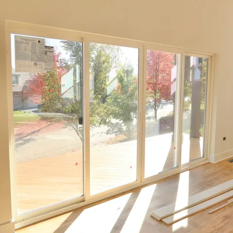 a view of a glass door with a floor to ceiling window