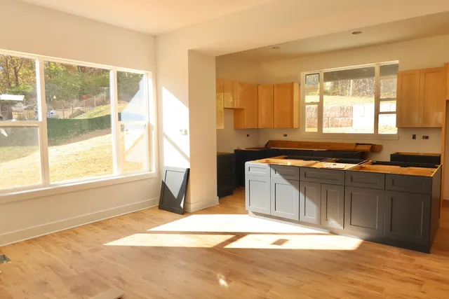 a kitchen with a sink and a window