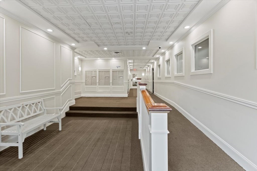116 Rantoul Street, Unit 307 Beverly, MA 01915 - Photo 18 of 19 a view of entryway with stairs and wooden floor