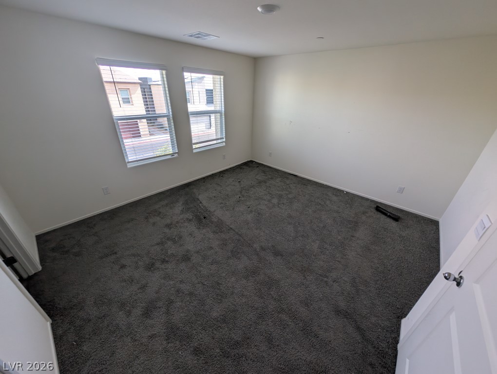 4820 Orchid Rdg Avenue Las Vegas, NV 89141 - Photo 9 of 16 Well-lit room with ample space, offering a clean canvas for your personal style.