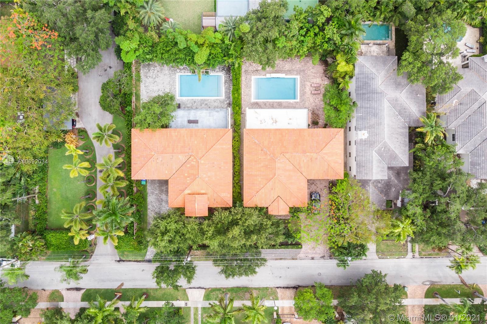 an aerial view of a house with a yard and plants