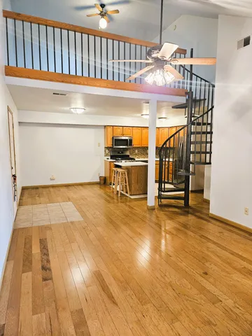 a bathroom with a sink mirror vanity and toilet