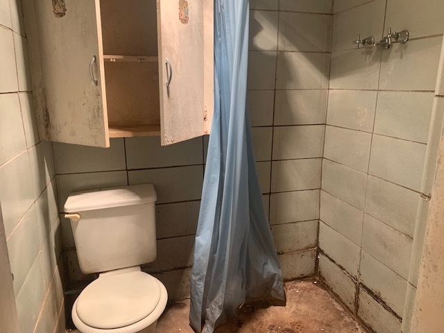 321 East Washington Street Ottawa, IL 61350 - Photo 14 of 20 a white toilet sitting next to a bathroom sink