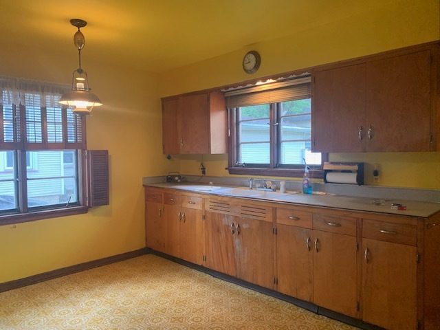 321 East Washington Street Ottawa, IL 61350 - Photo 4 of 20 a kitchen with sink and window