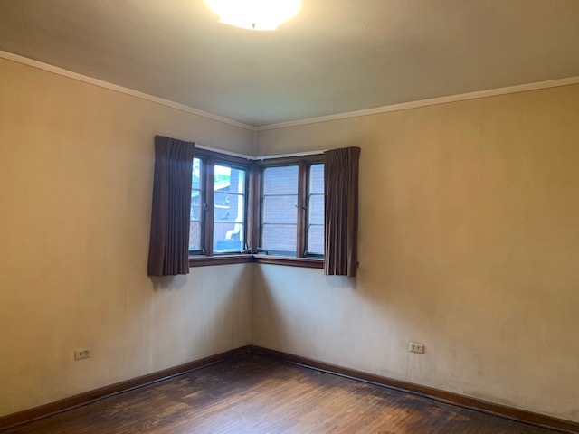321 East Washington Street Ottawa, IL 61350 - Photo 8 of 20 a view of an empty room with wooden floor and a window