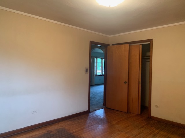 321 East Washington Street Ottawa, IL 61350 - Photo 9 of 20 an empty room with wooden floor and entrance