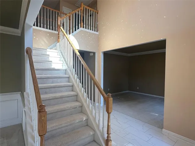 a view of entryway and hall with a window