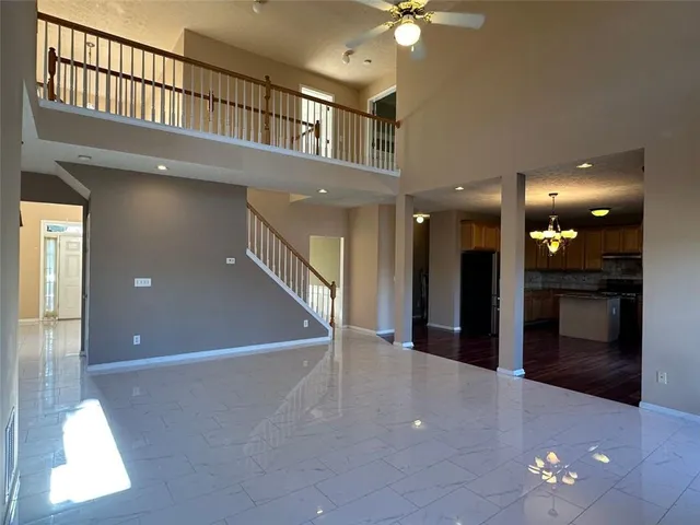 a bathroom with a sink a toilet and a window