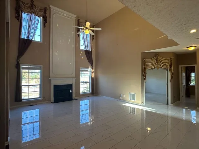 a kitchen with wooden floors and appliances