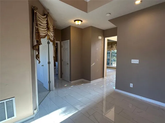 a view of a kitchen from the hallway
