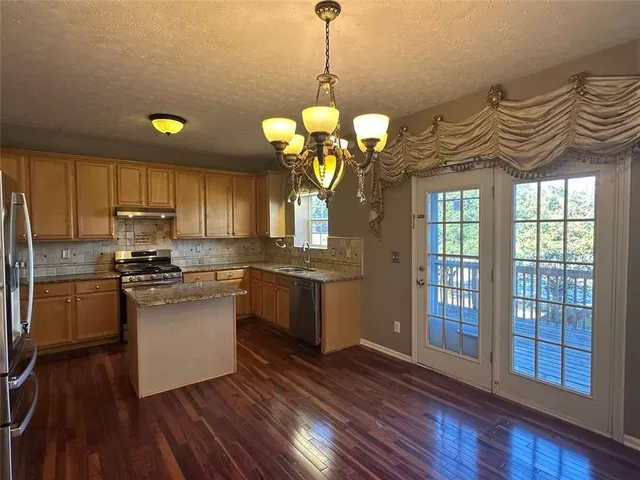 a view of a hallway with a stairs