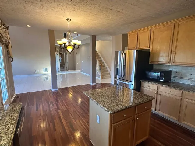 a white toilet sitting next to a bath tub