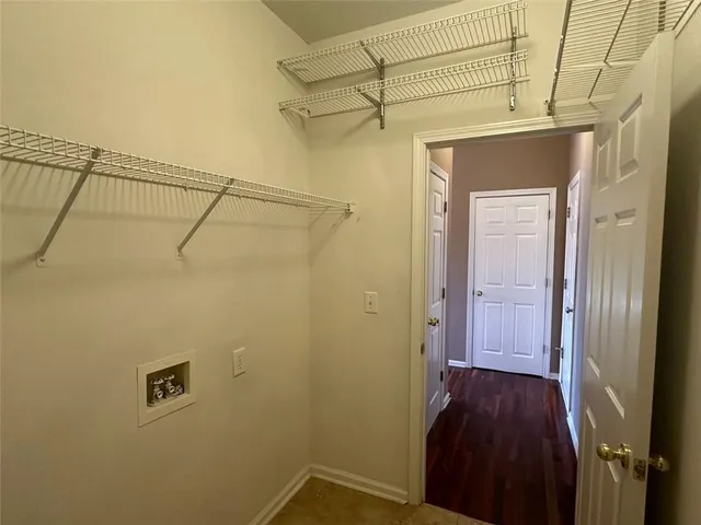 a view of a living room with furniture and a flat screen tv