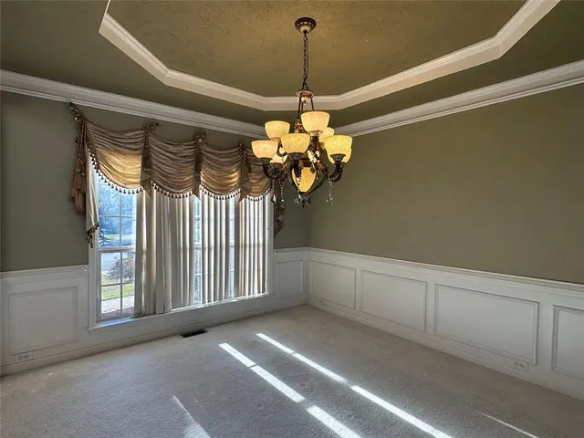 a bathroom with a granite countertop toilet and a bathtub