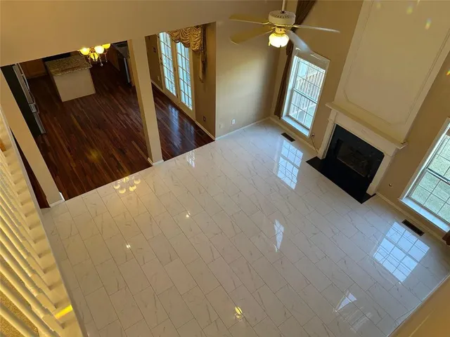 a view of a kitchen with a sink and dishwasher a stove top oven with a dining table