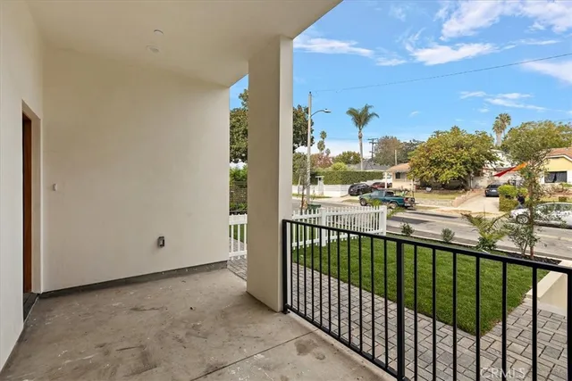a view of kitchen with wooden floor and electronic appliances