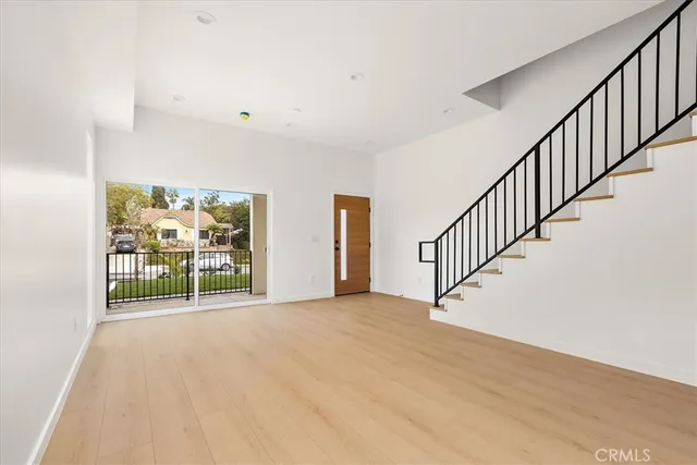 a kitchen with cabinets and window