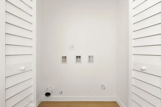 a view of a kitchen cabinets and a wooden floor