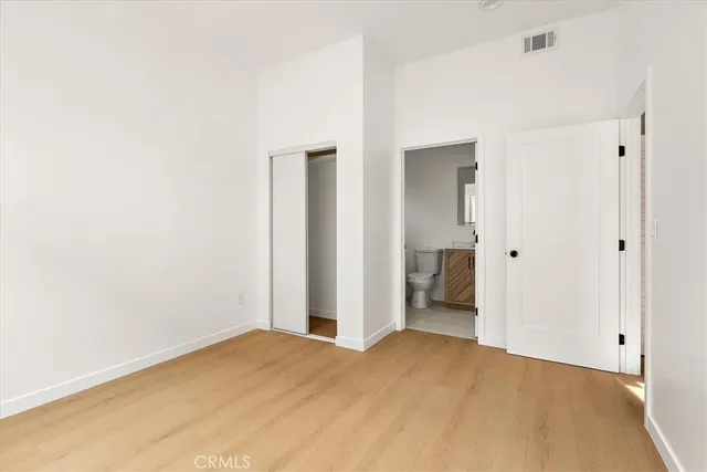 a view of an empty room with glass door