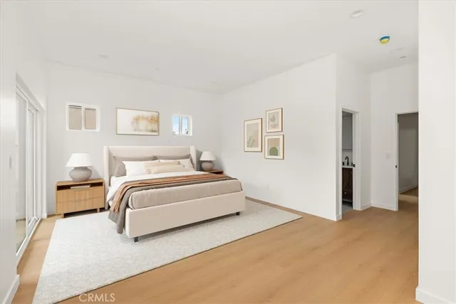 a bedroom with a bed and a couch