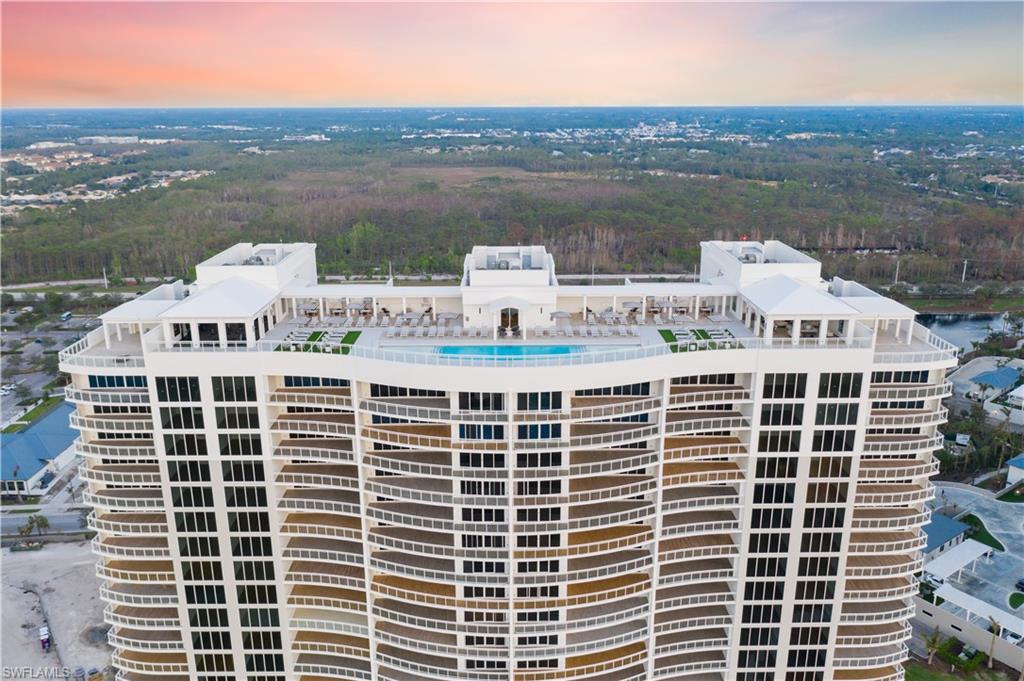 13945 Old Coast Road, Unit PH02 Naples, FL 34110 - Photo 5 of 8 a view of a city with tall buildings