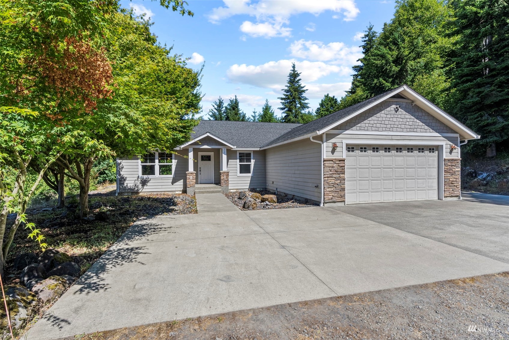 241 Puma Road Longview, WA 98632 - Photo 1 of 24 a view of a house with a yard and large tree
