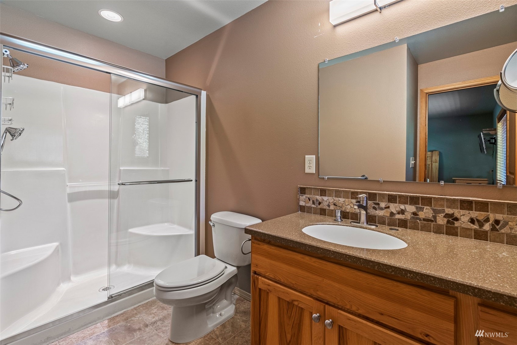 241 Puma Road Longview, WA 98632 - Photo 13 of 24 a bathroom with a sink toilet and shower