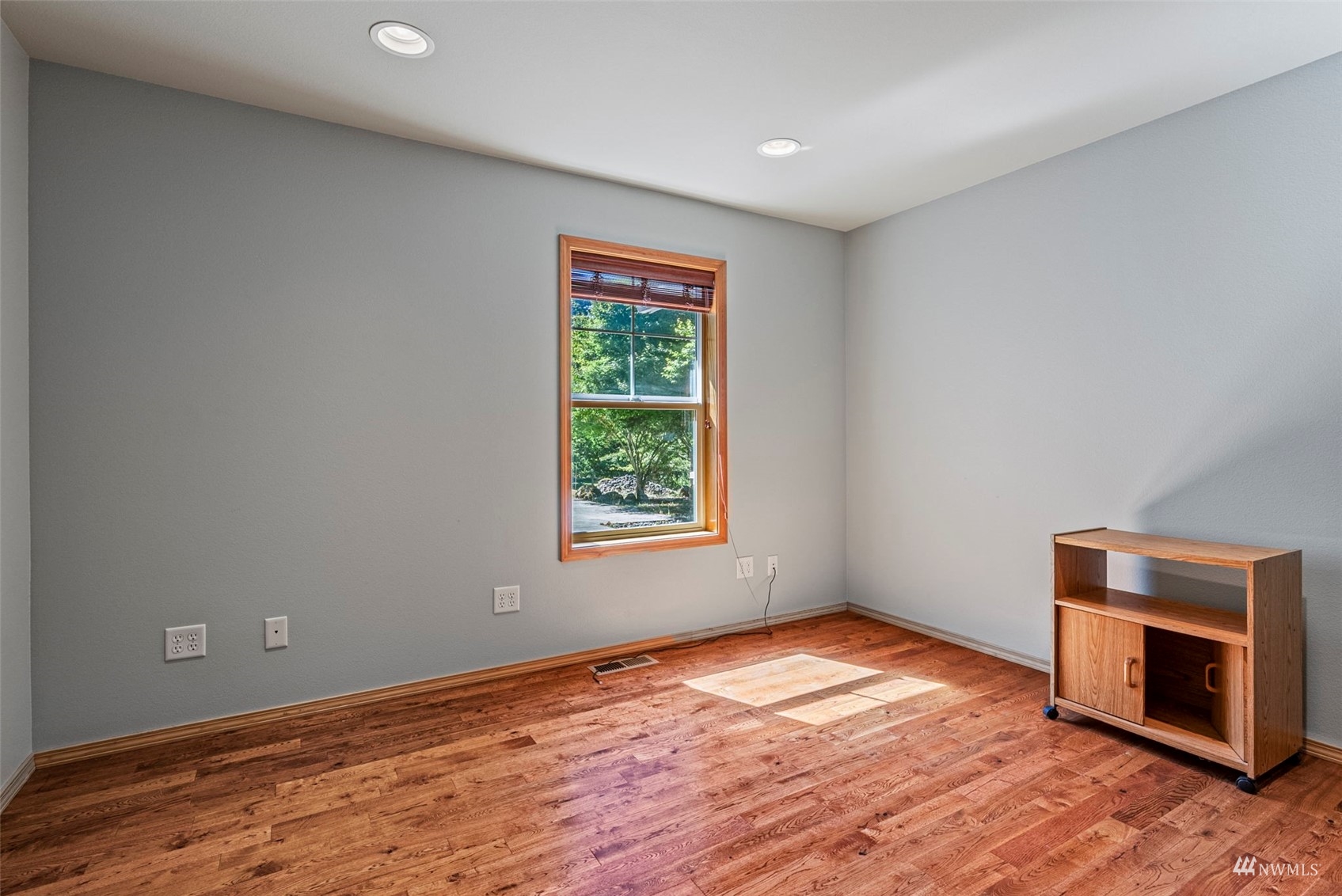 241 Puma Road Longview, WA 98632 - Photo 15 of 24 a view of empty room with wooden floor and fireplace