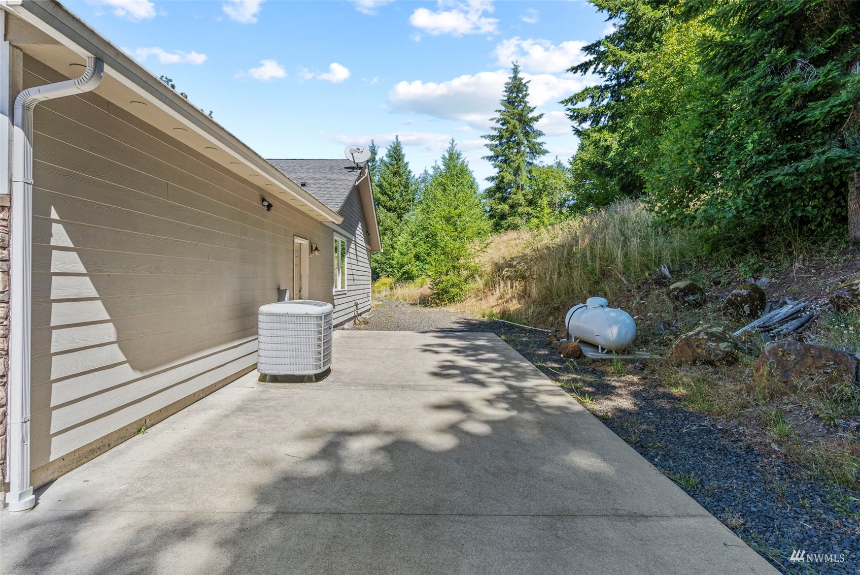 241 Puma Road Longview, WA 98632 - Photo 20 of 24 a view of a outdoor space with a chair and potted plant