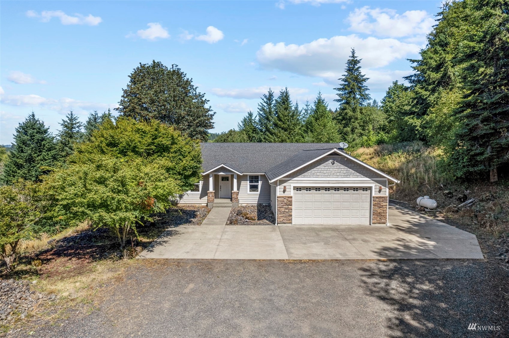 241 Puma Road Longview, WA 98632 - Photo 2 of 24 a view of house and outdoor space with green space