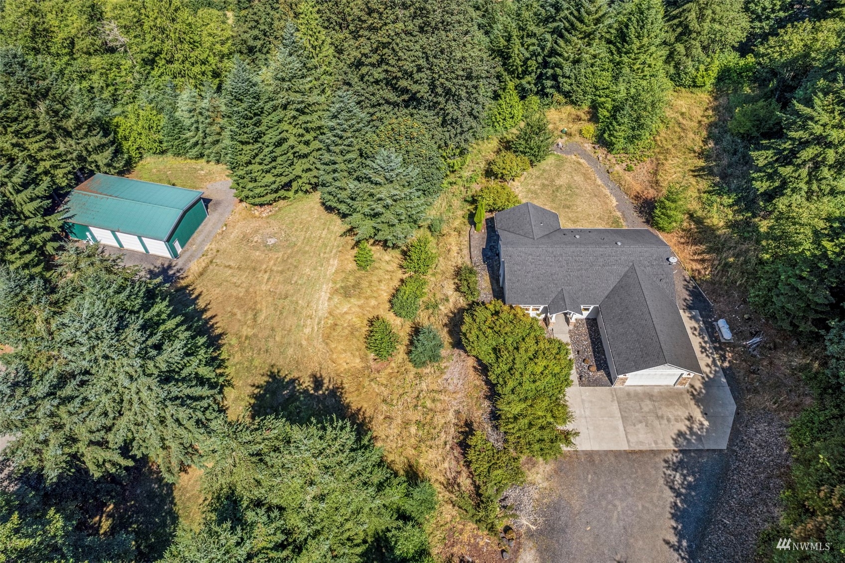 241 Puma Road Longview, WA 98632 - Photo 3 of 24 an aerial view of a house with a yard and lake view