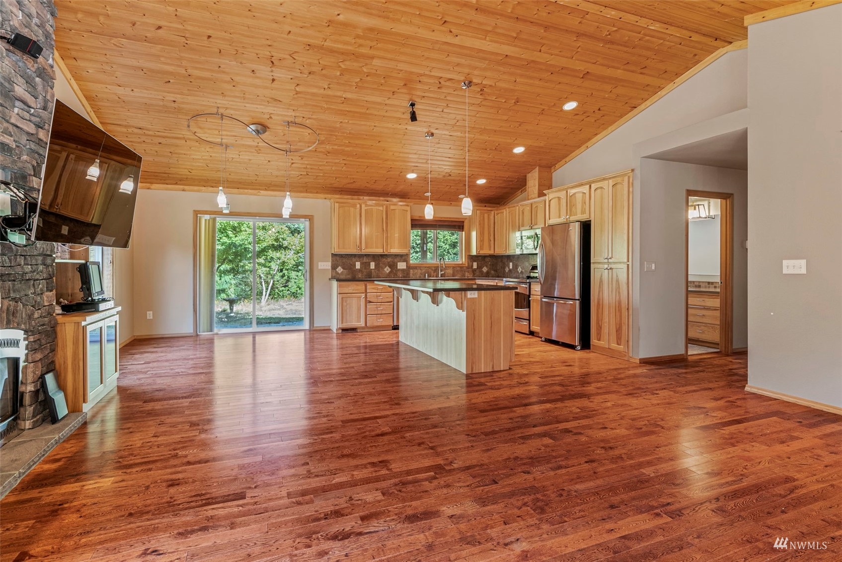 241 Puma Road Longview, WA 98632 - Photo 4 of 24 a view of a kitchen with a refrigerator and a stove