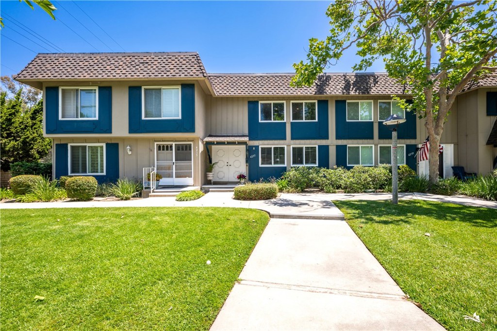 4237 Larwin Avenue Cypress, CA 90630 - Photo 4 of 48 a front view of a house with swimming pool having outdoor seating