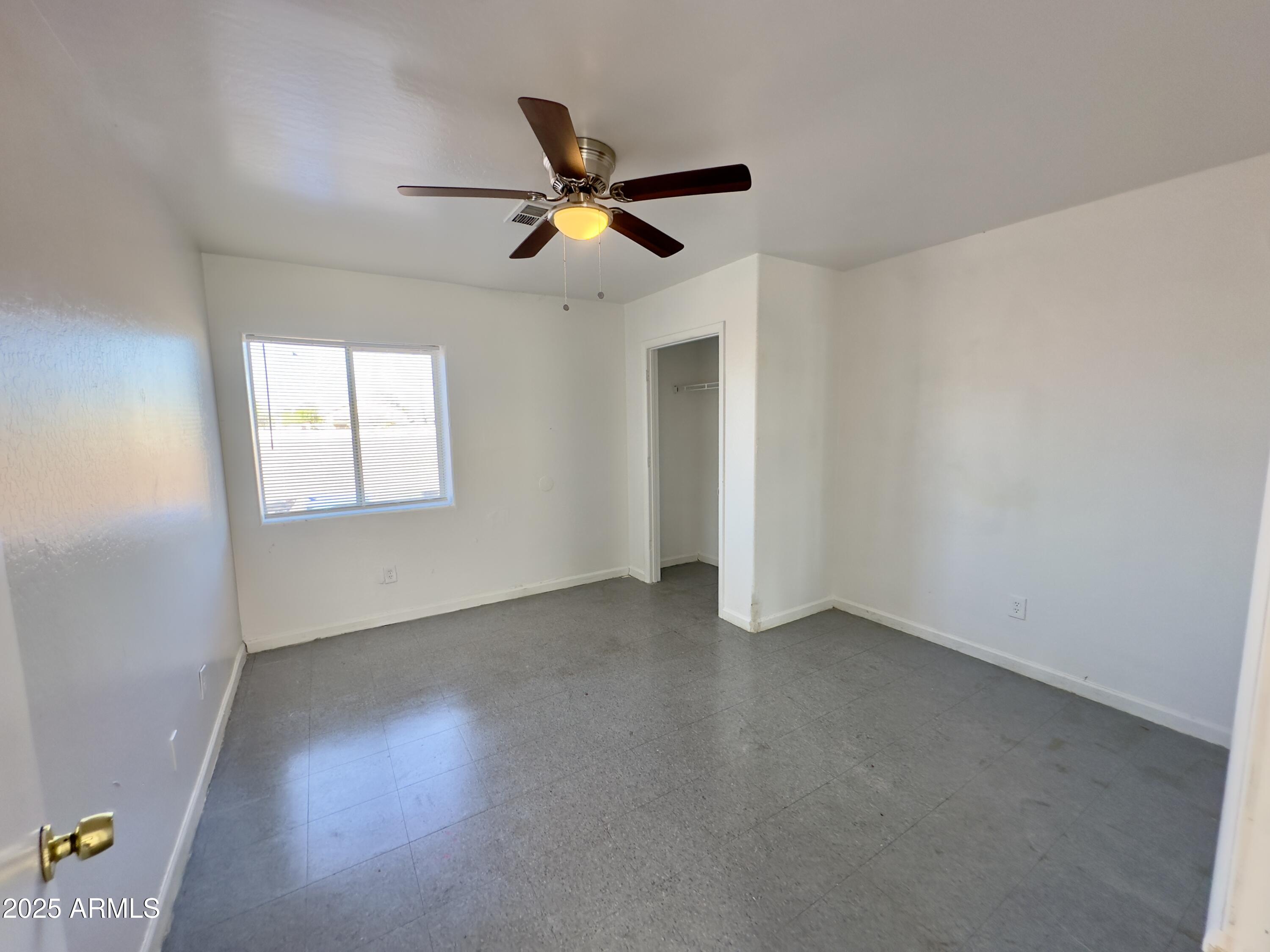1224 East Apache Street, Unit 2 Phoenix, AZ 85034 - Photo 14 of 17 a view of an empty room with a window