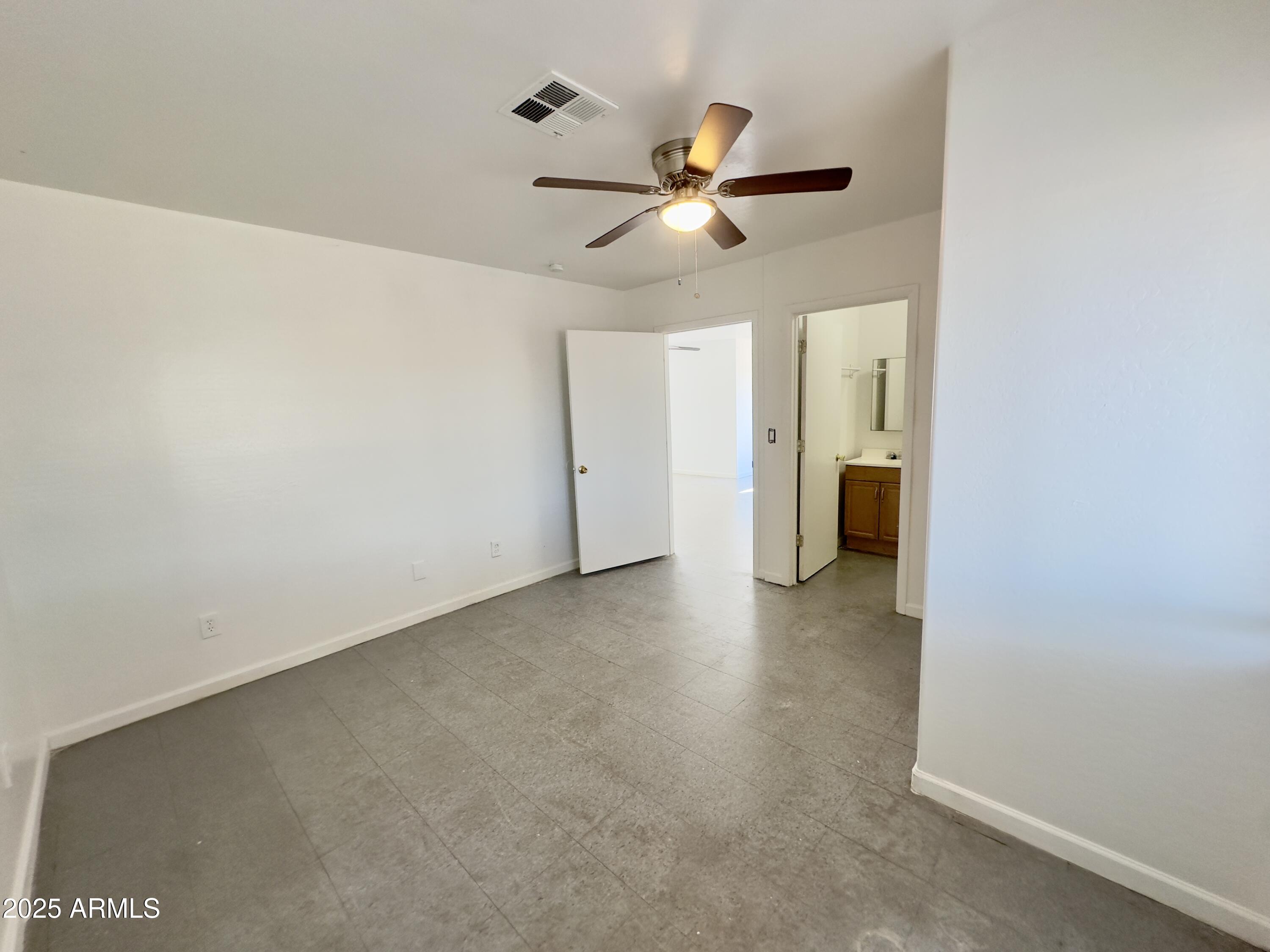 1224 East Apache Street, Unit 2 Phoenix, AZ 85034 - Photo 8 of 17 a view of a livingroom with a ceiling fan and window