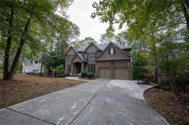 a front view of a house with yard