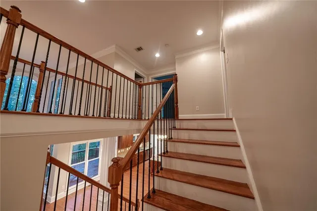 a view of a livingroom with a chandelier fan