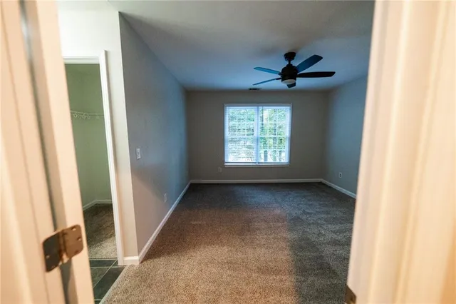 a bathroom with a granite countertop sink toilet a large mirror a bathtub and shower