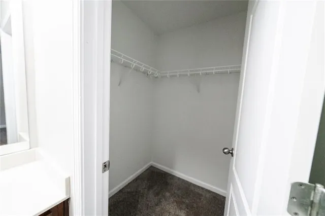 an empty room with a ceiling fan