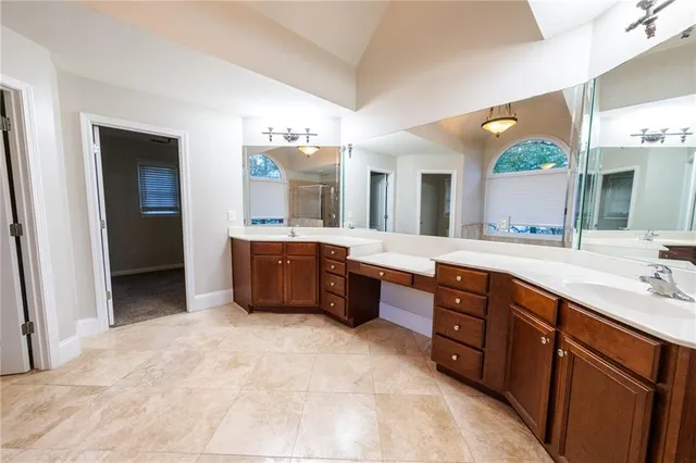 a view of bathroom with bathtub and shower
