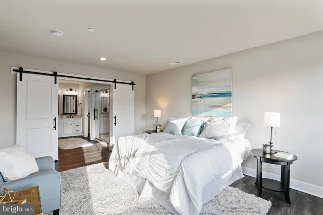 a bedroom with a bed and a couch