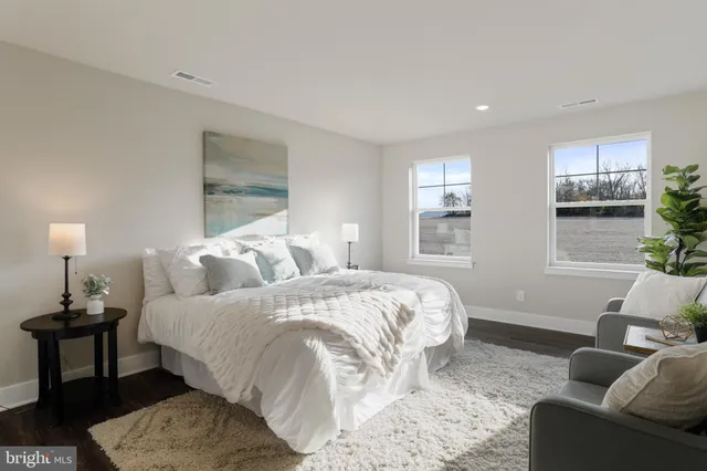 a bedroom with bed and window