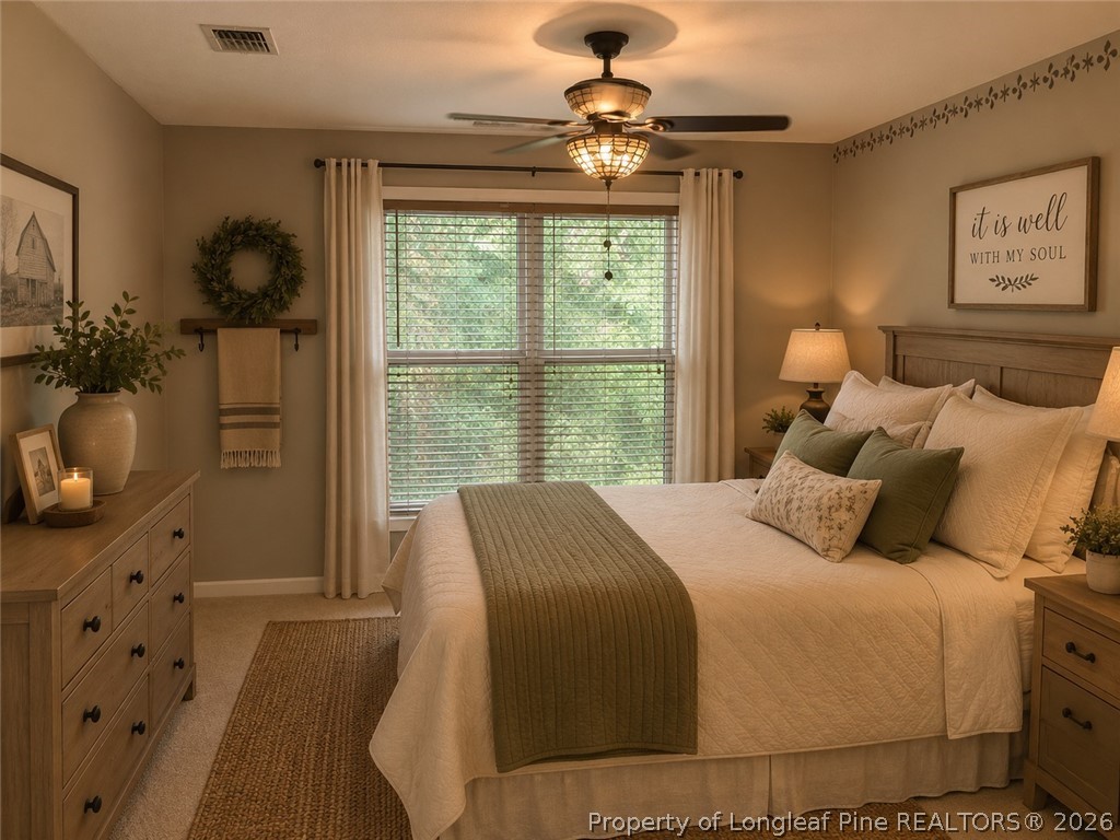 1833 Sardonyx Road, Unit 3 Fayetteville, NC 28303 - Photo 7 of 10 a bedroom with a large bed and a window