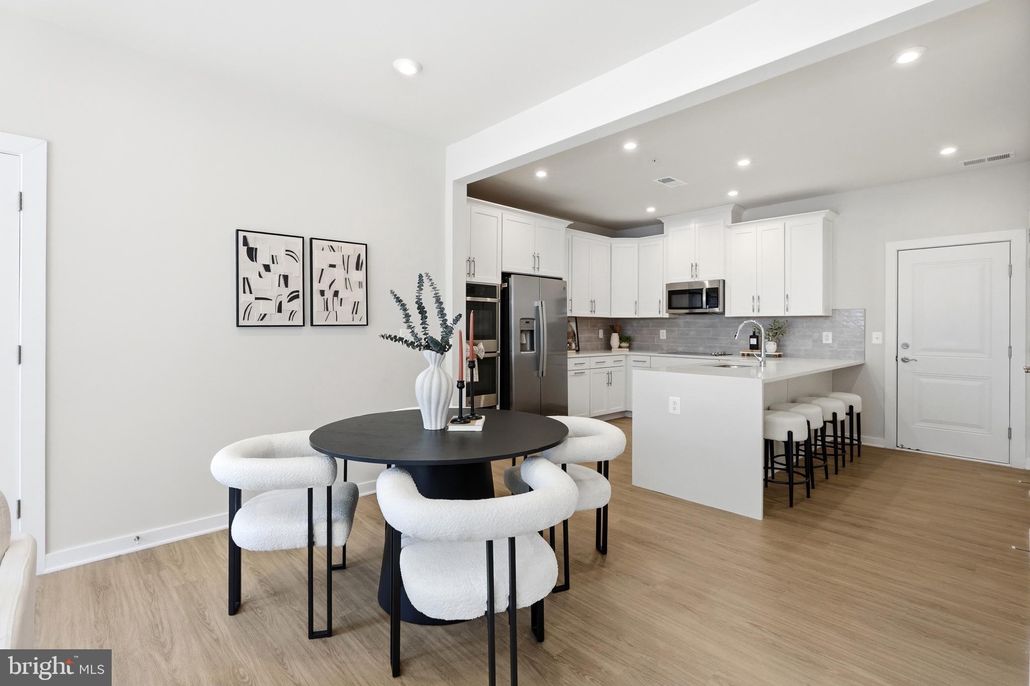4128 Legato Road, Unit 53 Fairfax, VA 22033 - Photo 9 of 40 Effortless Flow from Living to Dining