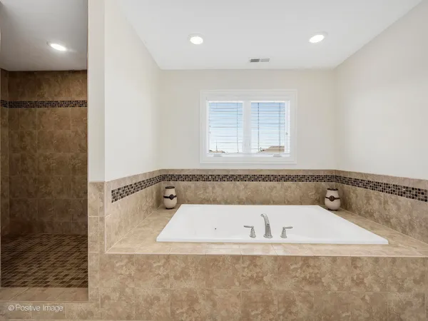 a white bath tub sitting in a bathroom