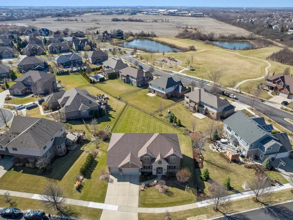 an aerial view of a house with a ocean view